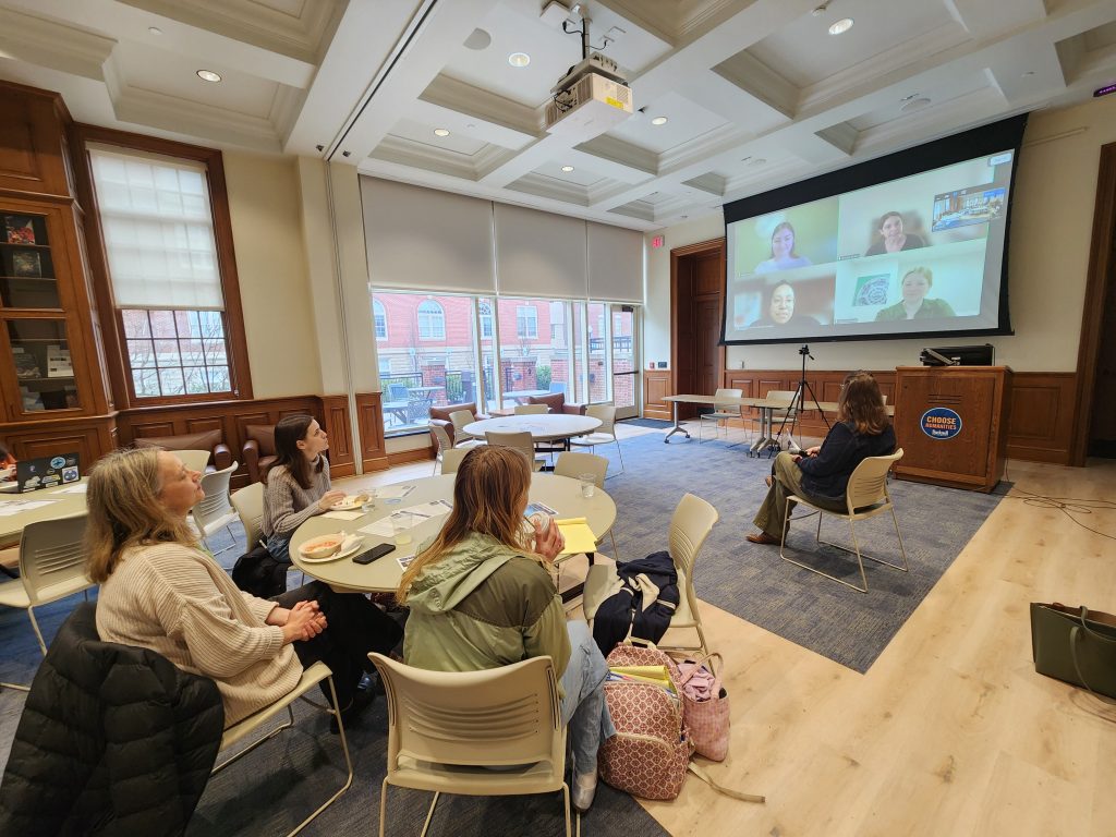 Students listening to alumni discussing their careers