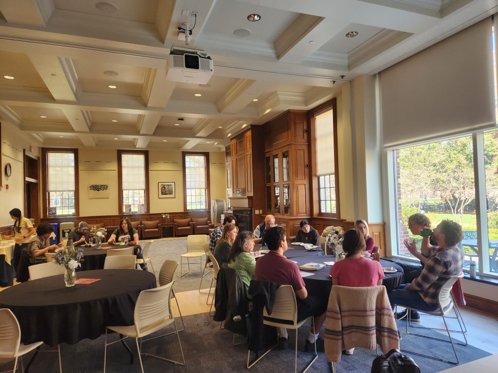 Chris and Sam discussing audio production with students and faculty